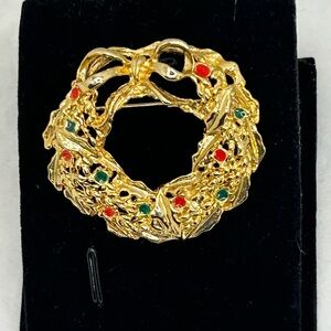 Elegant Gold Wreath Brooch with Red and Green Accents